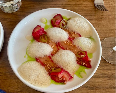 Bread with butter, martini glasses, and fish crudo at Modern Bird in Traverse City, Michigan.