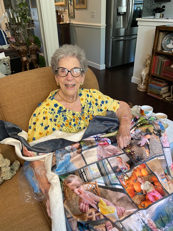Picture of a bridge in Lisbon, Portugal; Grandma in a yellow dress holding a blanket with Addy; Moose in Grand Tetons National Park and Addy and Lydia at Trout Lake in Yellowstone