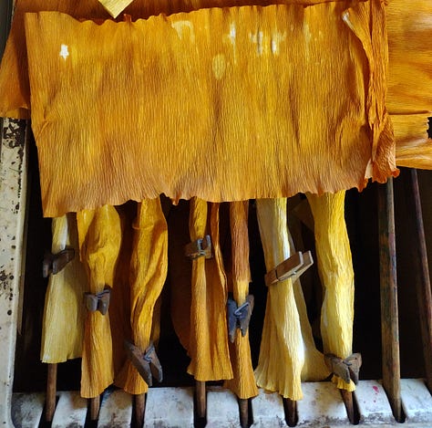 Papers coloured a range of deep yellows, saffrons, mustards and greys created by dyeing using onion skins, tea and iron