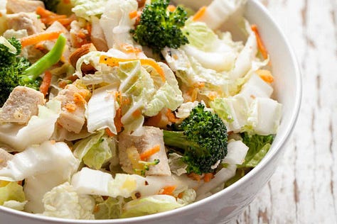 Six dinner salad recipes including Asian coleslaw, Caesar salad with chicken, salmon salad, Southwest chicken salad and a quick taco salad.