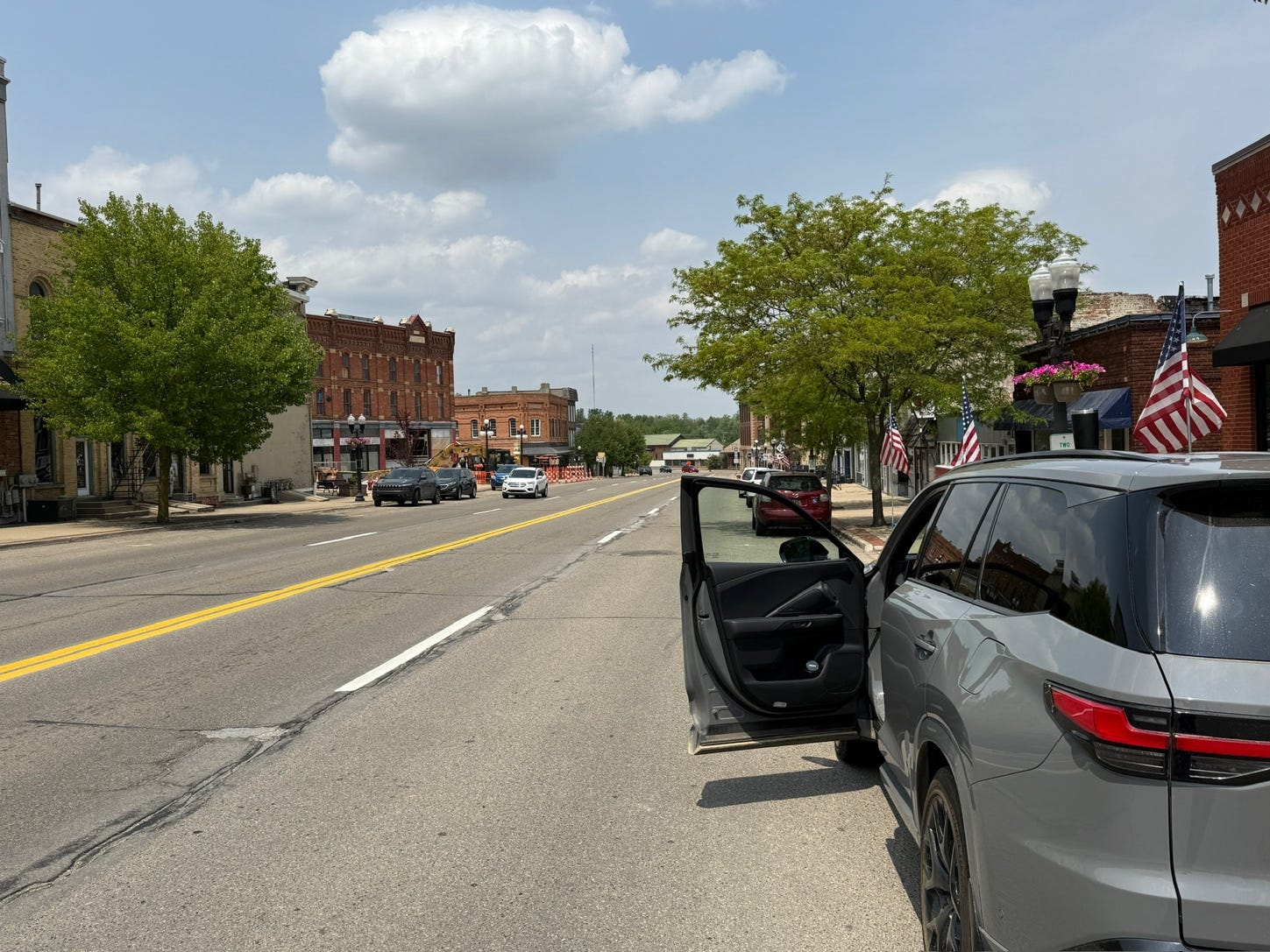 A car with the door open on the side of the road

AI-generated content may be incorrect.