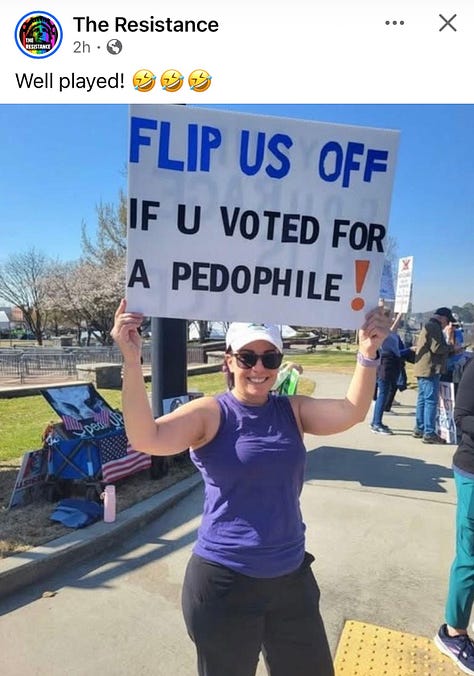Protesters and dogs with signs at an outdoor rally