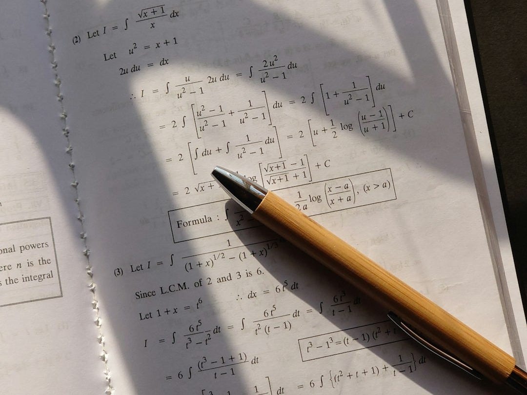 a pen sitting on top of a piece of paper