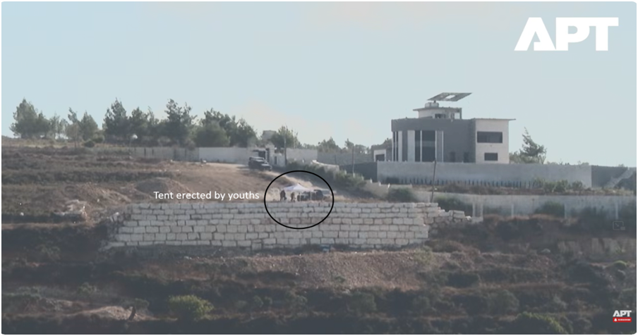 The youths’ encampment and one of the Palestinian compounds outside Qusra. Screenshot from APT video, August 2026.