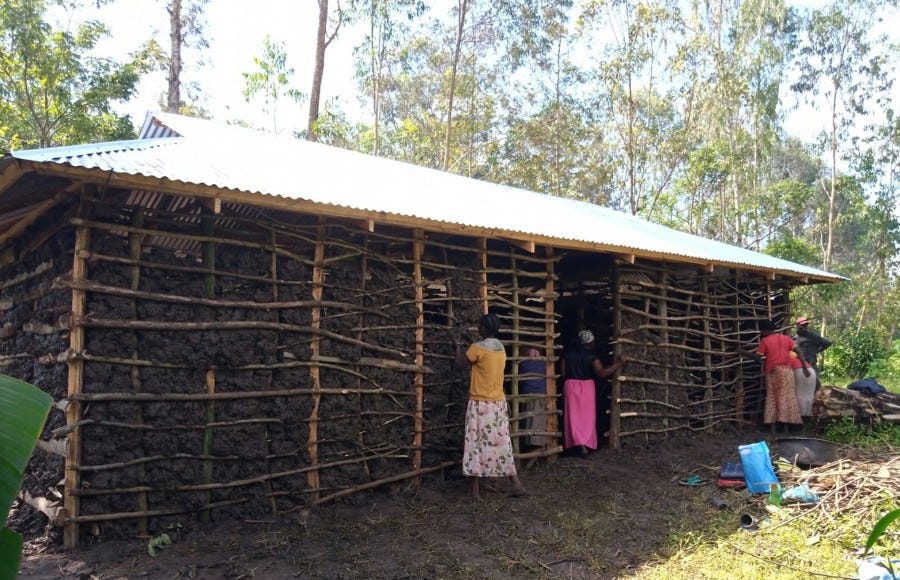 A house in Kenya made from wooden poles, iron roof sheets, and mud.