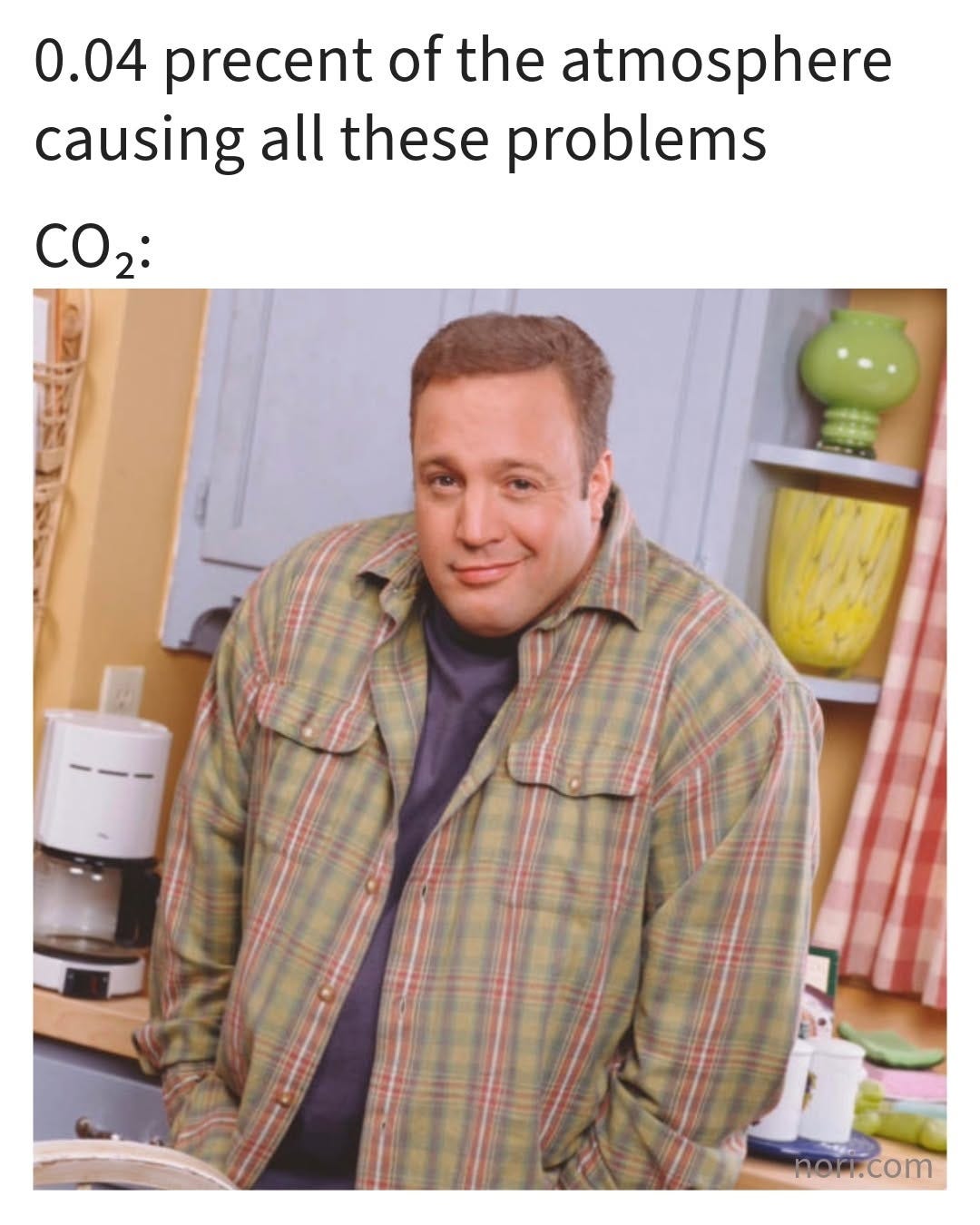 Text reading "0.04 precent of the atmosphere causing all these problems. CO2:" above a smiling man in a plaid shirt standing in a kitchen.