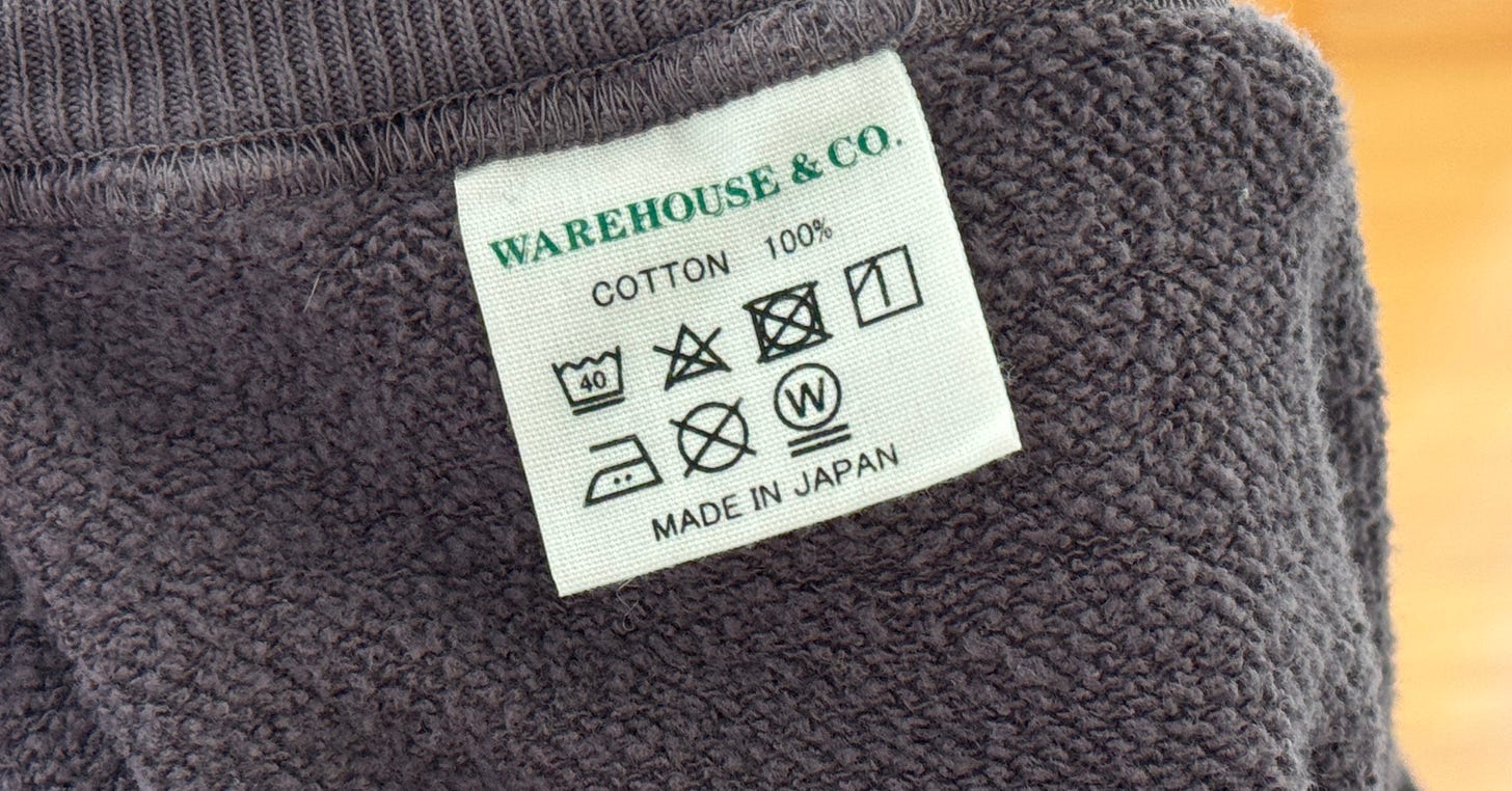 photo of care instructions tag for a sweater, including a "Made in Japan" detail