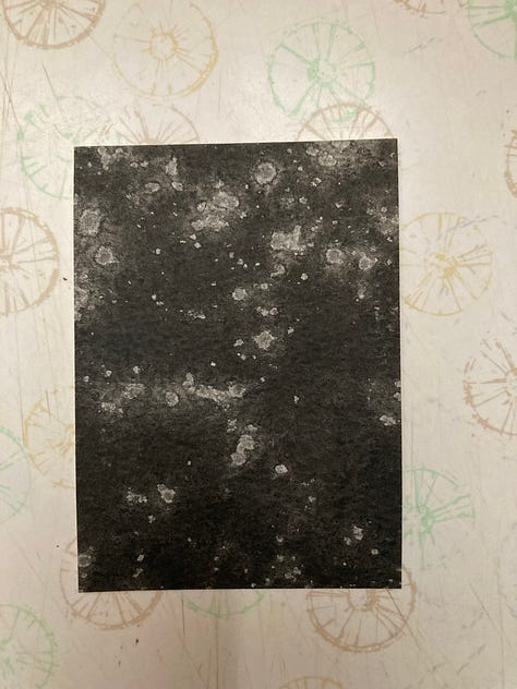 2.5 by 3.5 inch cards painted in black watercolor with random white splotches