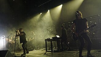Nine Inch Nails performing at the O2 Apollo Manchester in 2022; (L–R): Ilan Rubin, Trent Reznor, Alessandro Cortini, Atticus Ross, Robin Finck