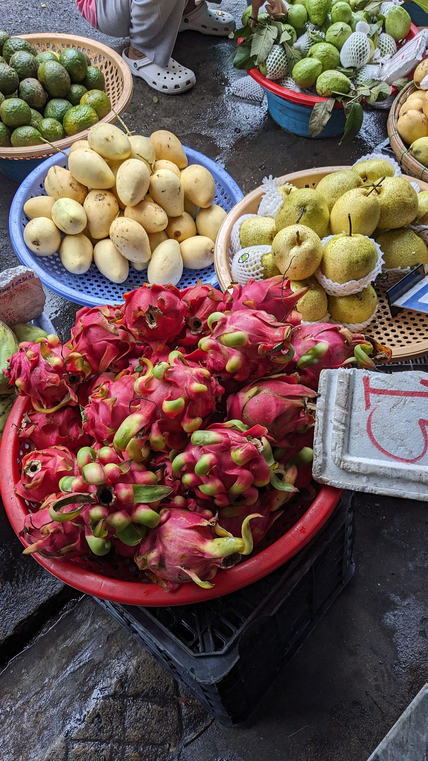 mangos, oranes and dragonfruit at the market