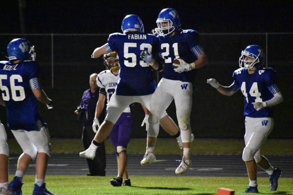 Wrightstown football players celebrating after a touchdown. Wrightstown football players celebrating after a touchdown.