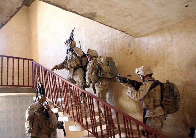 US Marines from 3rd Battalion, 3rd Marines clear a house during an operation in Al Anbar Governorate. US Marines from 3rd Battalion, 3rd Marines clear a house during an operation in Al Anbar Governorate.