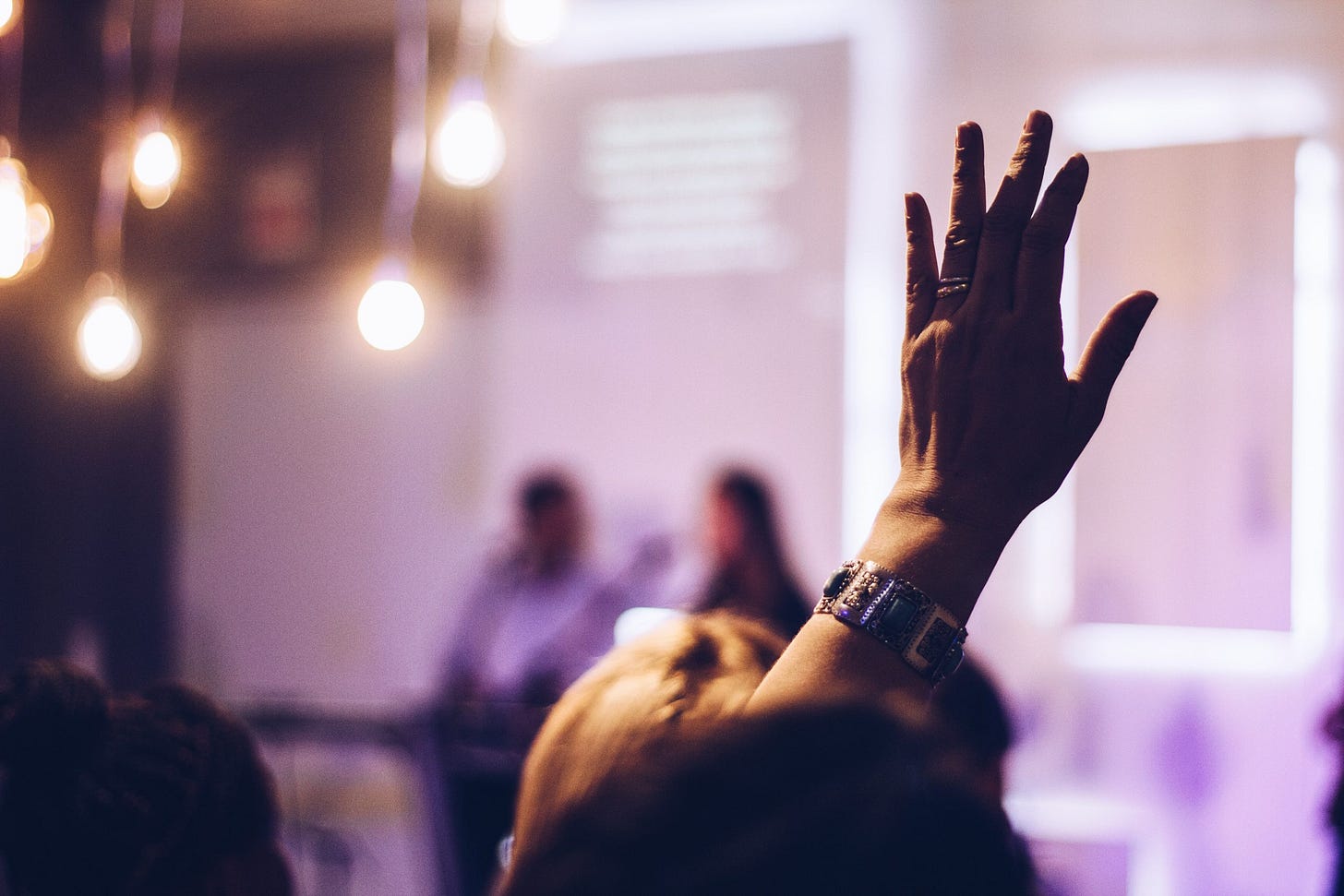 Hand raised in response