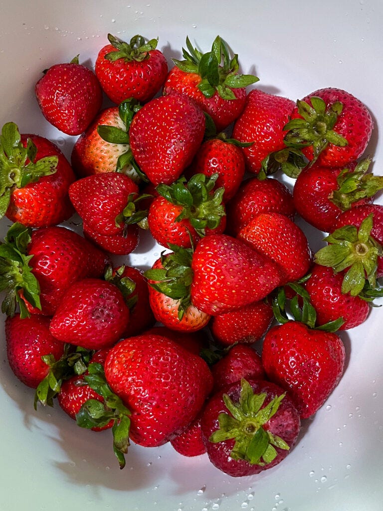 fresh washed strawberries in a bowl