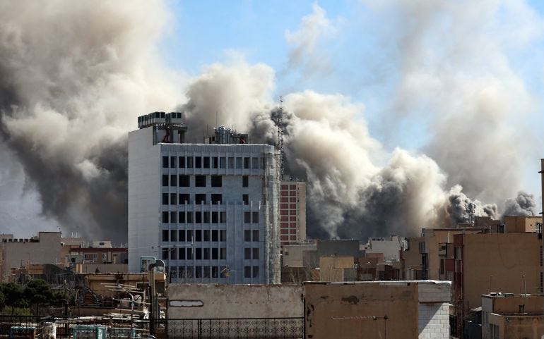 Smoke rises in central Tehran after an Israeli Smoke rises in central Tehran after an Israeli