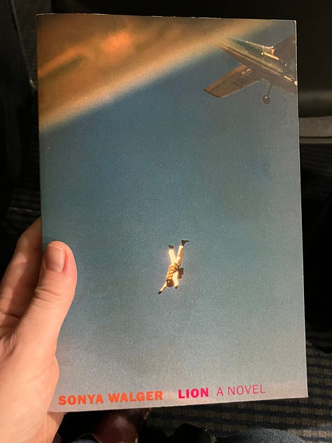6 different images, books lying on a table or being held up by my hand: Audition by Katie Kitamura, Lion by Sonya Walger, The Rooftop Garden by Menaka Raman-Wilms, A Convergence of Solitudes by Anita Anand, The Immortal Woman by Su Chang, and The Parisian by Isabella Hammad