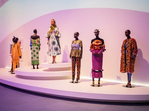 a display at a museum with mannequins with clothes on them