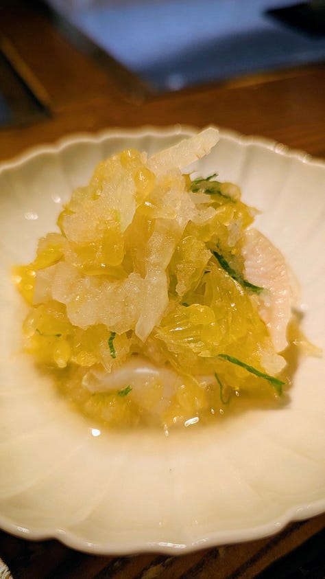 Japanese-style rooms, bowls of food, and bottles of sake.