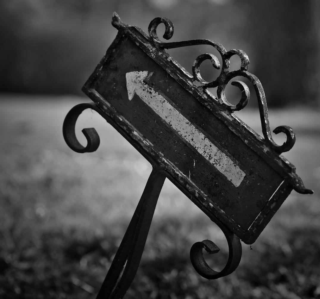 a bench with a pair of scissors