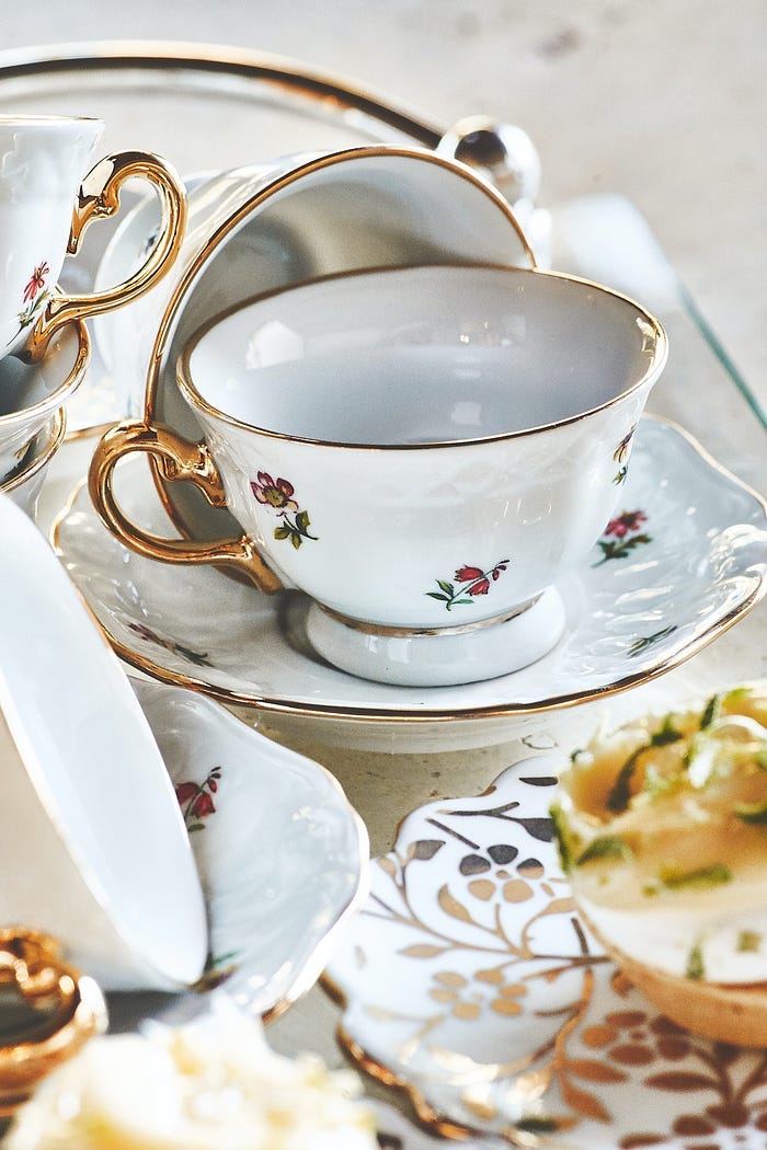 A very fine white porcelain tea set, edges and handles picked out in gold. A very fine white porcelain tea set, edges and handles picked out in gold.