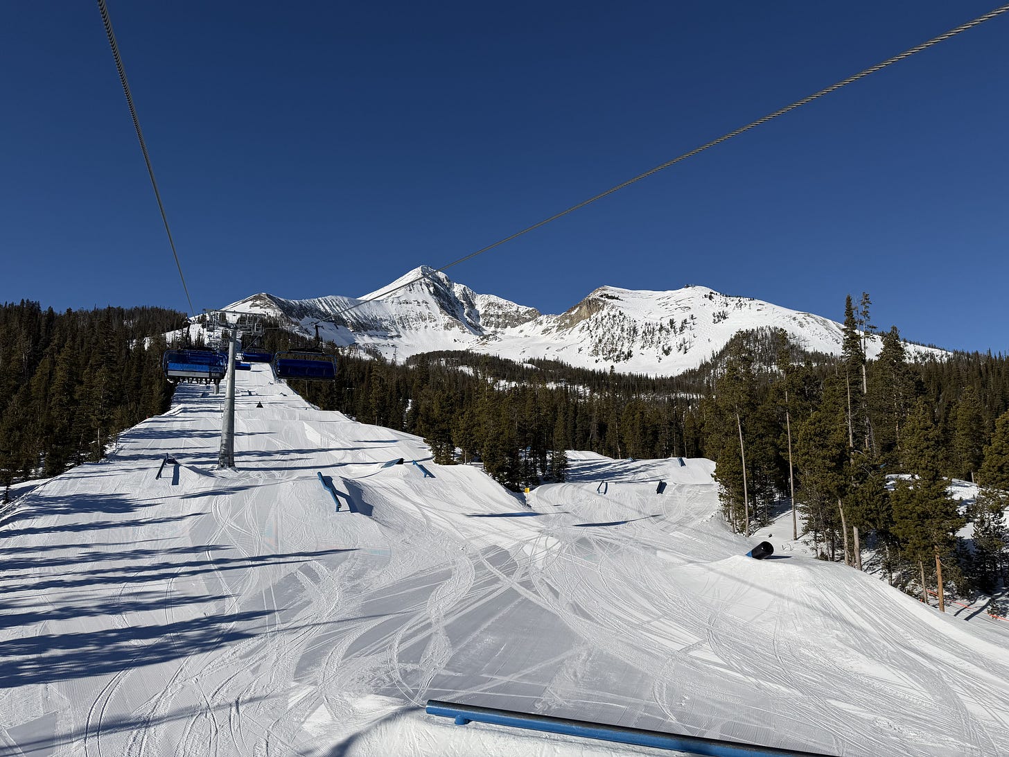 Lone Peak above Big Sky's terrain park on a bluebird day.