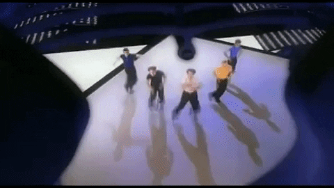 In the big open area, the guys are spinning around and then kicking one leg out in front of them and punching with both arms simultaneously.