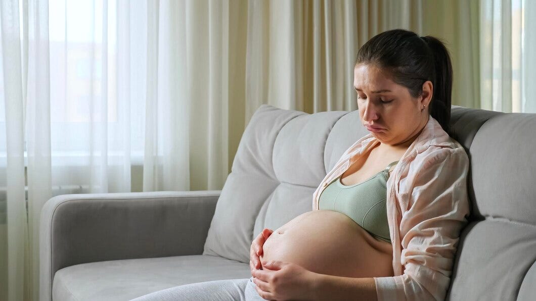 sad pregnant woman