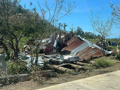 Super Typhoon Uwan (Fung-wong) destruction in Catanduanes, Philippines — homes in Barangay Mayngaway severely damaged after the November 2025 storm, documented by the Philippine Red Cross.