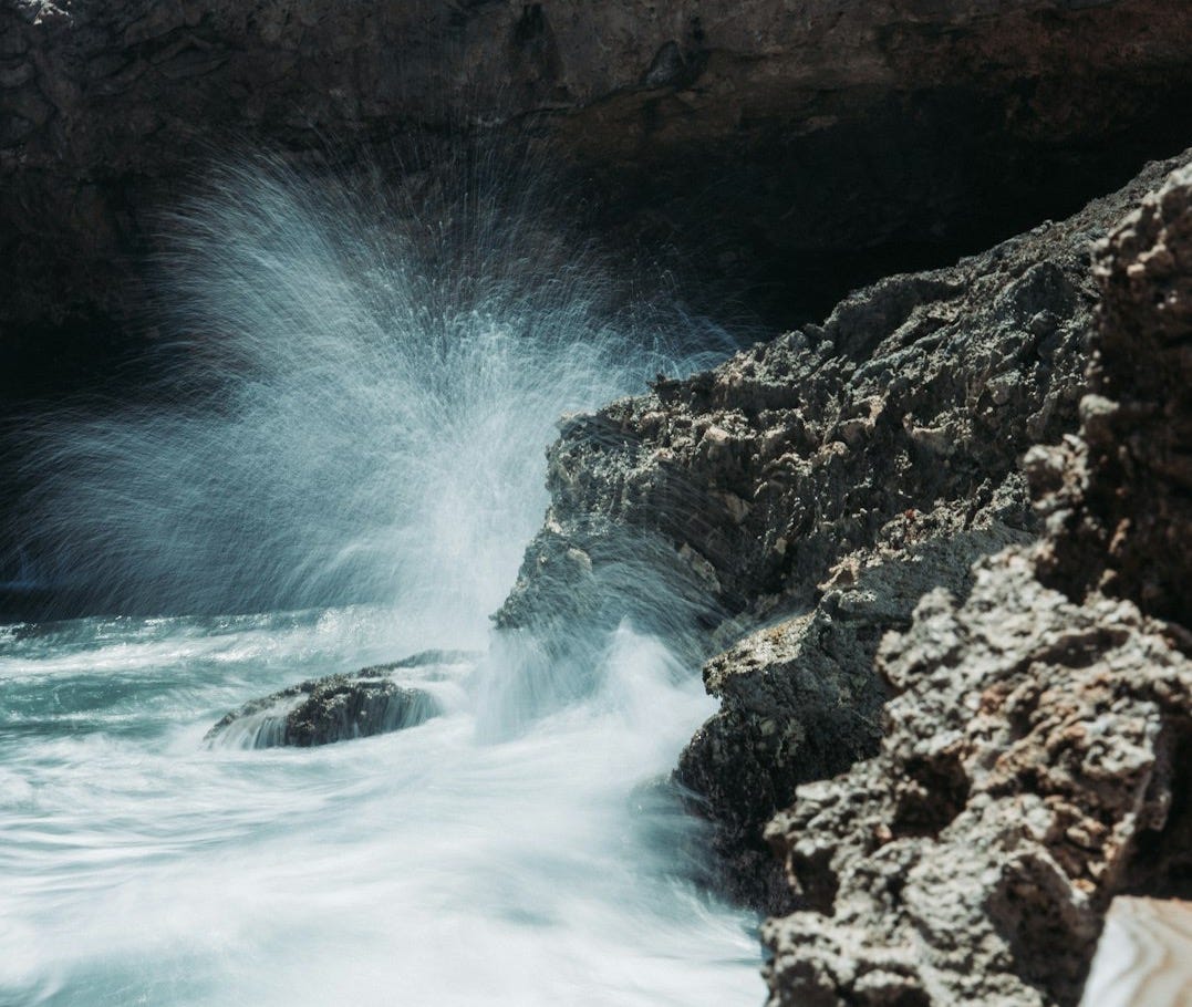 a waterfall over a cliff