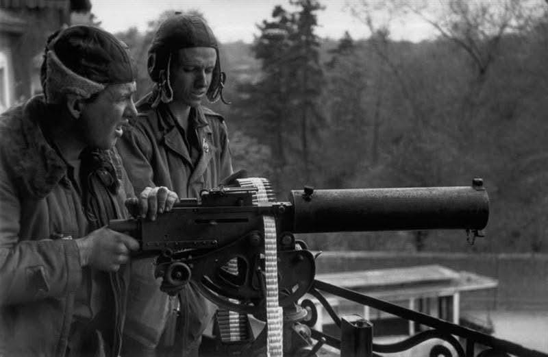PFC Raymond Bowman (R) and Lehmann Riggs (L) with their 30. Cal machine gun on a balcony in Leipzig, Germany, on April 18, 1945. Just minutes later Bowman was killed by a German sniper on that balcony, just 16 days after his 21st birthday.