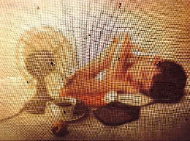 This may contain: a woman laying on the floor next to a fan and coffee cup with saucer This may contain: a woman laying on the floor next to a fan and coffee cup with saucer