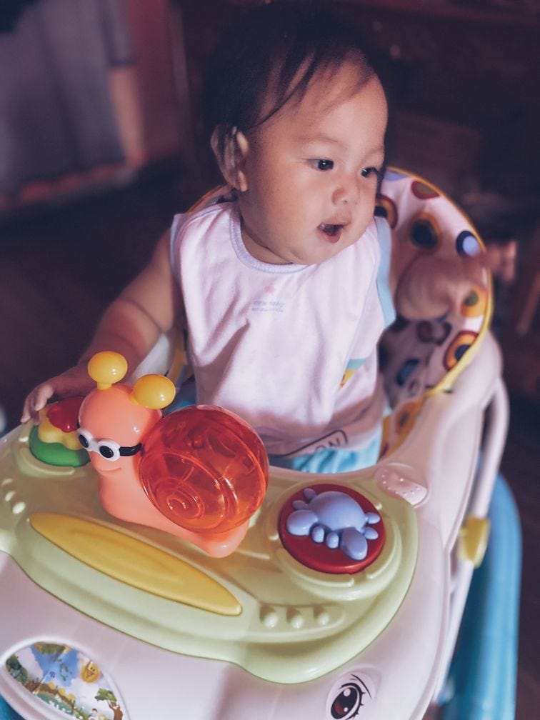 Baby gear Cute baby enjoying his walker