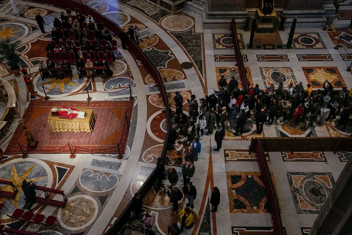 Mourners at the Vatican pay their respects to former Pope Benedict XVI as he lies in state inside St. Peter's Basilica on Tuesday, January 3. Mourners at the Vatican pay their respects to former Pope Benedict XVI as he lies in state inside St. Peter's Basilica on Tuesday, January 3.