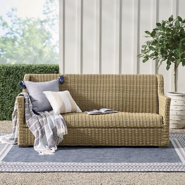 Montville Wicker Sofa with handwoven all-weather vinyl and sturdy aluminum frame, no cushions.