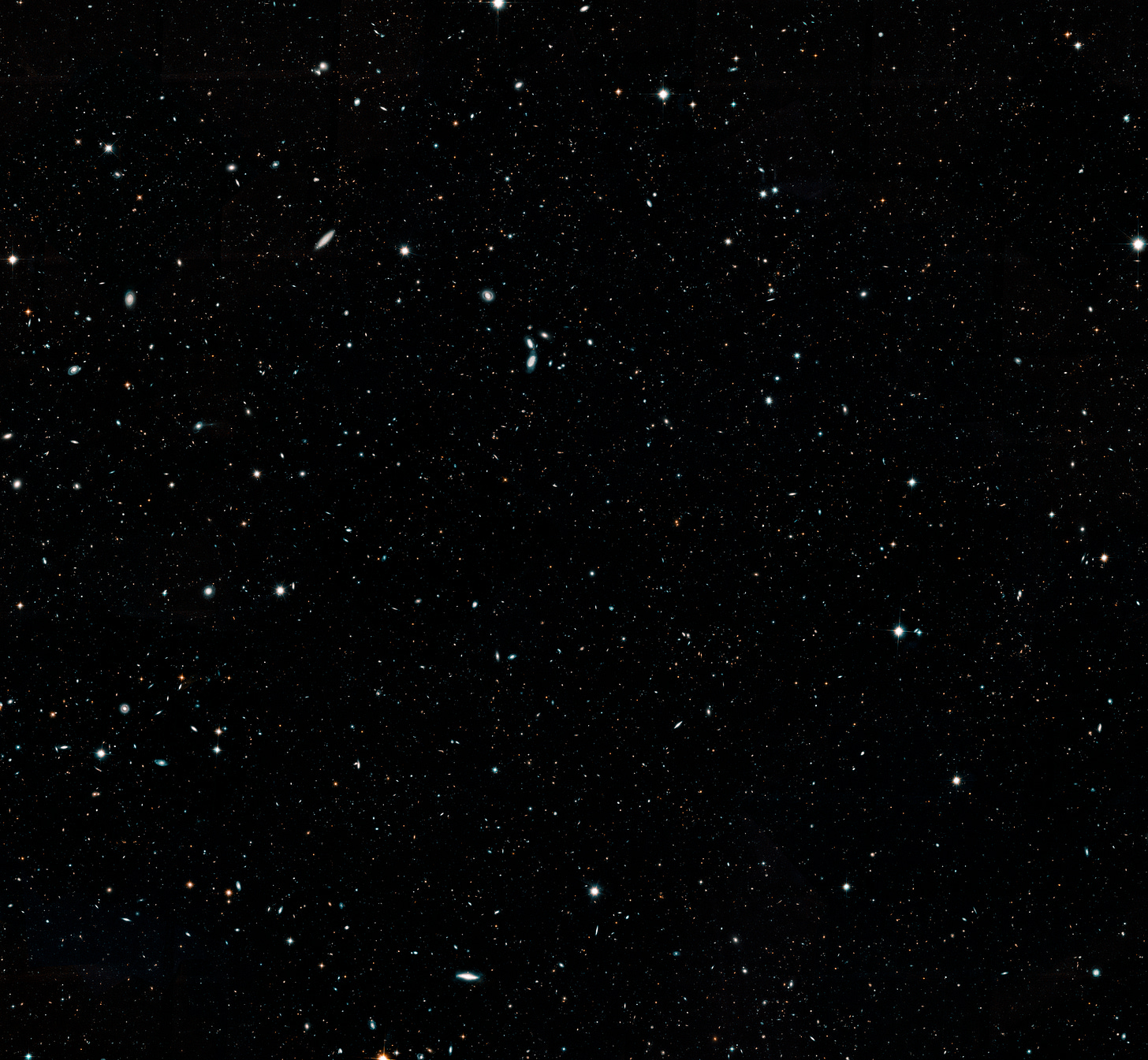 A dark sky full of galaxies and stars scattered across the view in a wide, breathtaking display. A dark sky full of galaxies and stars scattered across the view in a wide, breathtaking display.