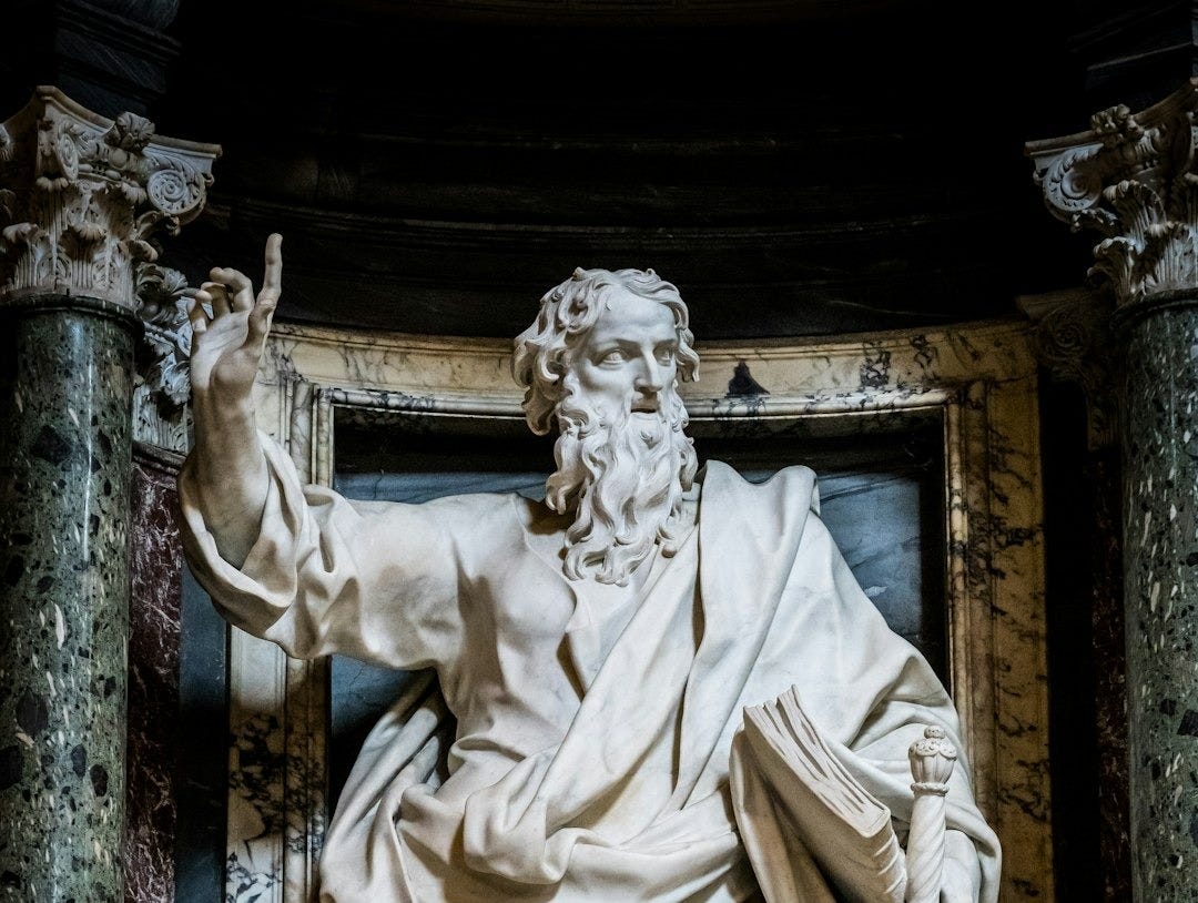 Marble statue of a bearded man with sword and sword. Marble statue of a bearded man with sword and sword.