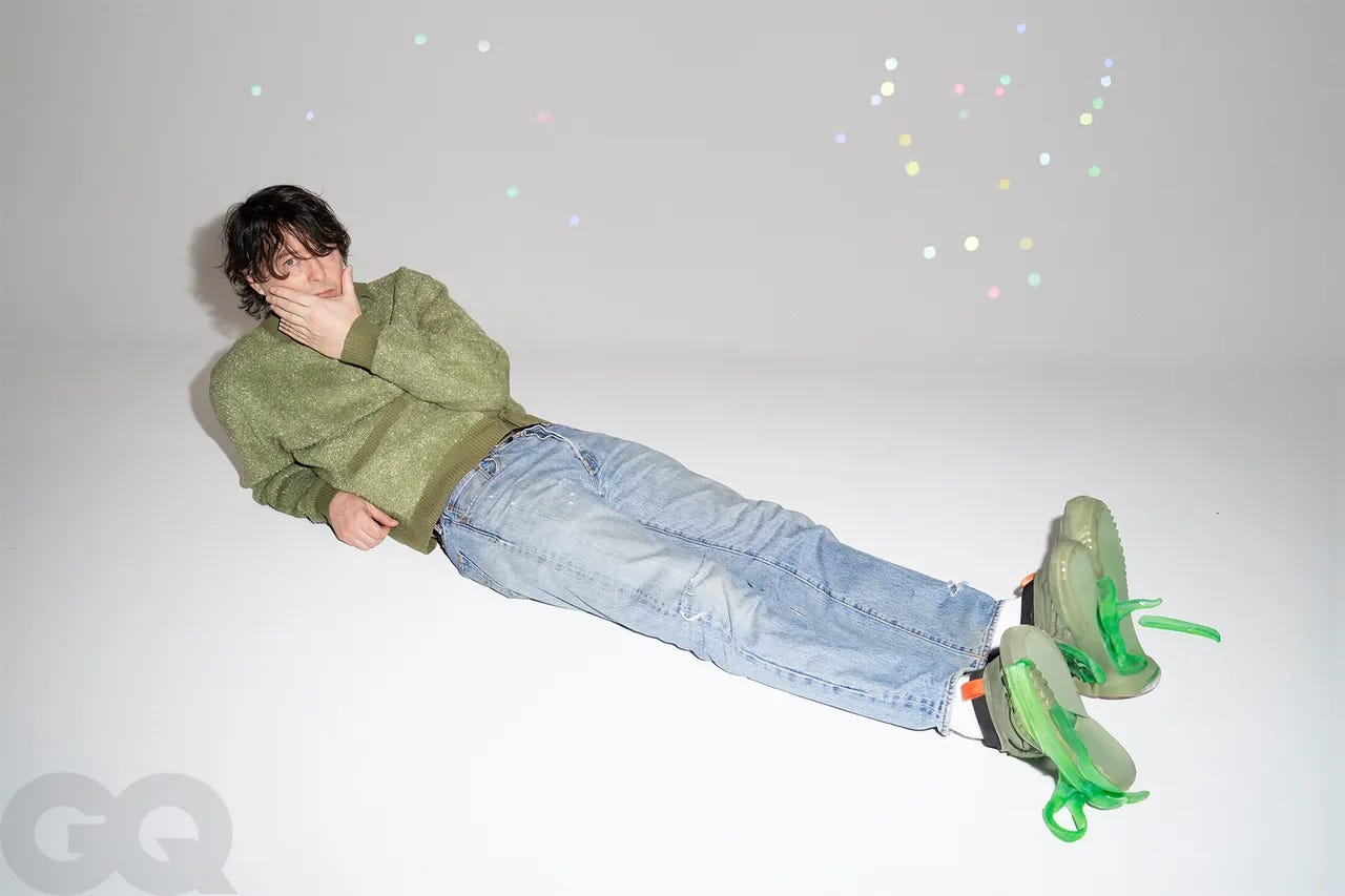 Image may contain Panda Bear Clothing Footwear Shoe Pants Person Teen Sneaker and Coat