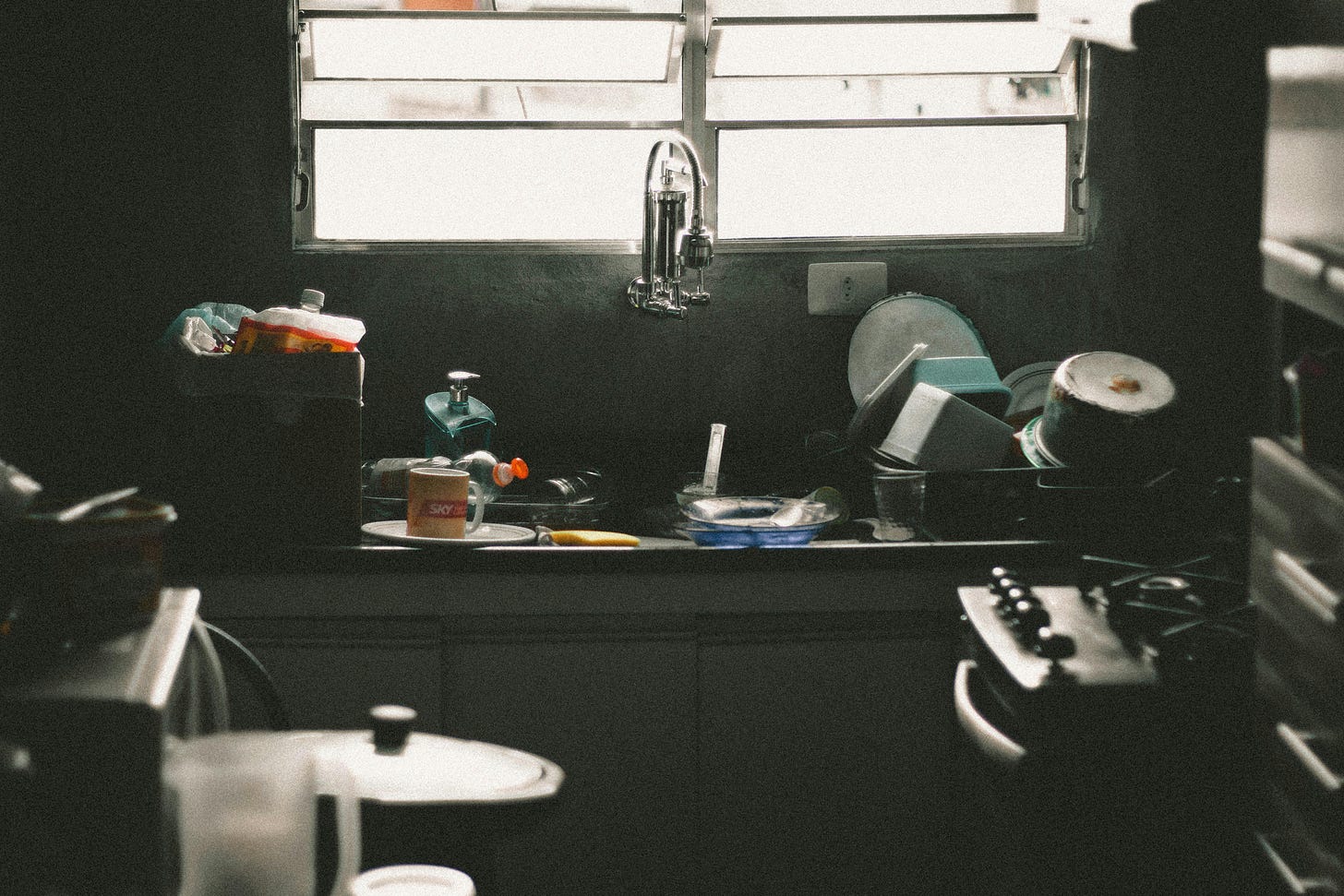 A dirty apartment kitchen. A dirty apartment kitchen.