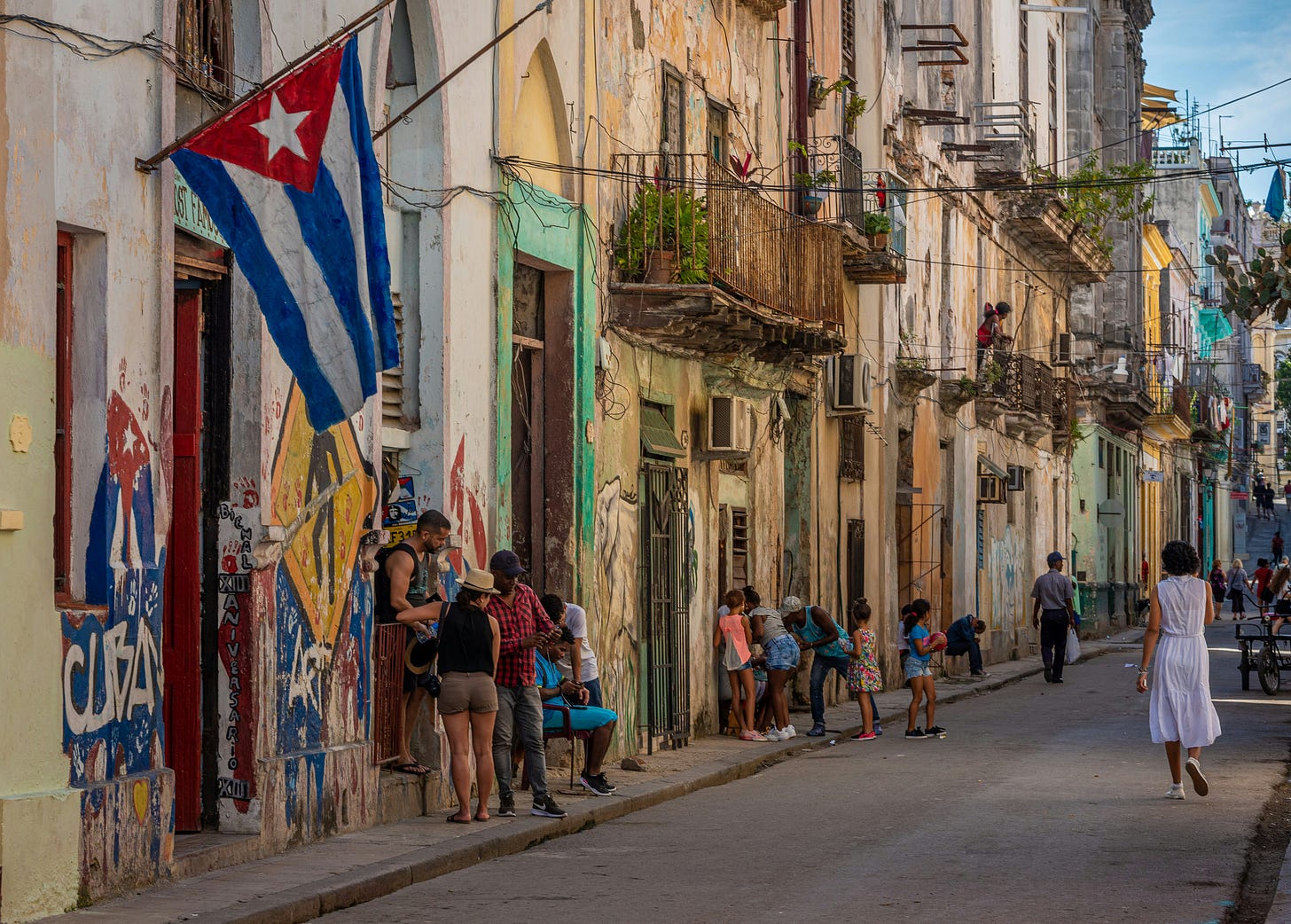 image of a street in cuba, people on sidewalk