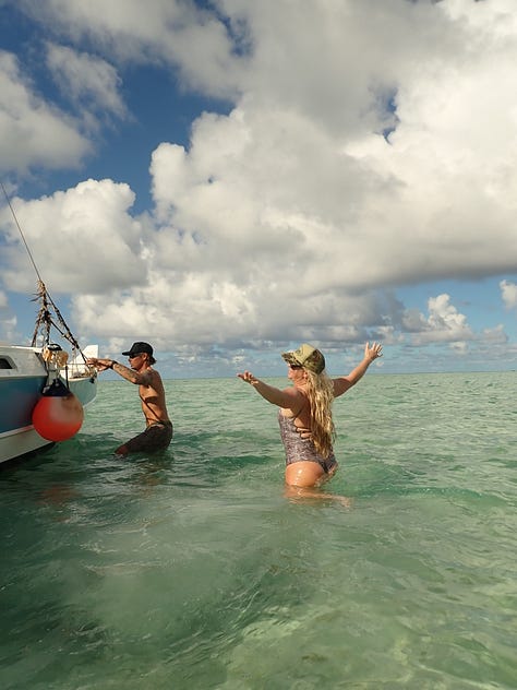 friends frolicking around kaneohe sandbar on a magical sunny day