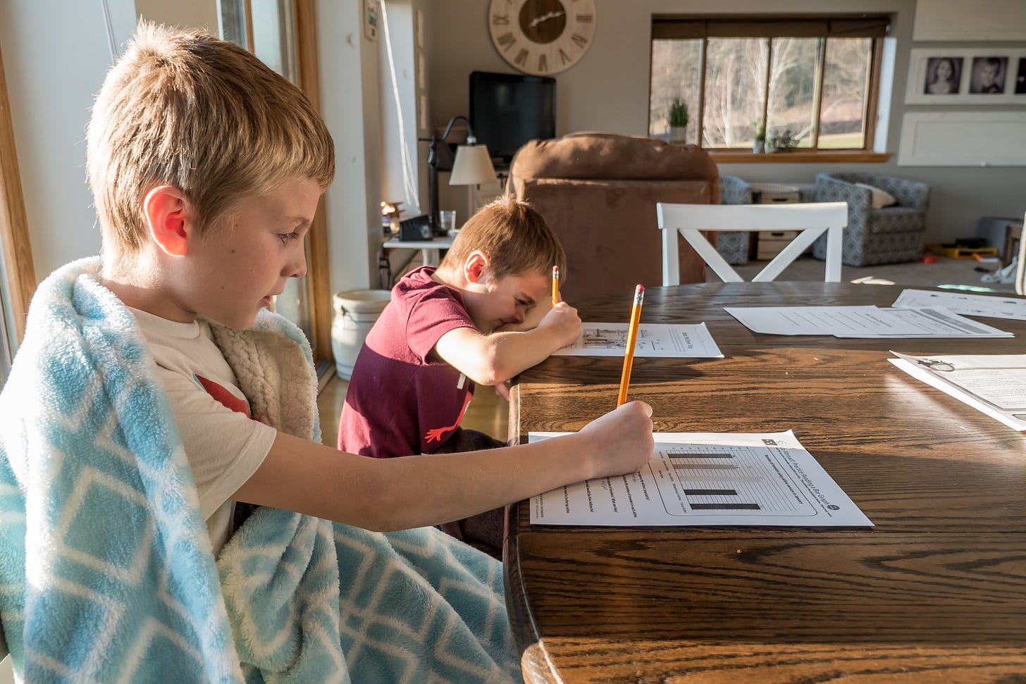 Photo of kids doing homework Photo of kids doing homework