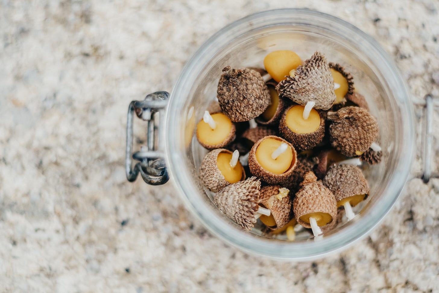 Jar holding acorn cap candles