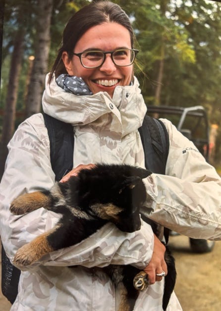 A person holding a dog

AI-generated content may be incorrect.