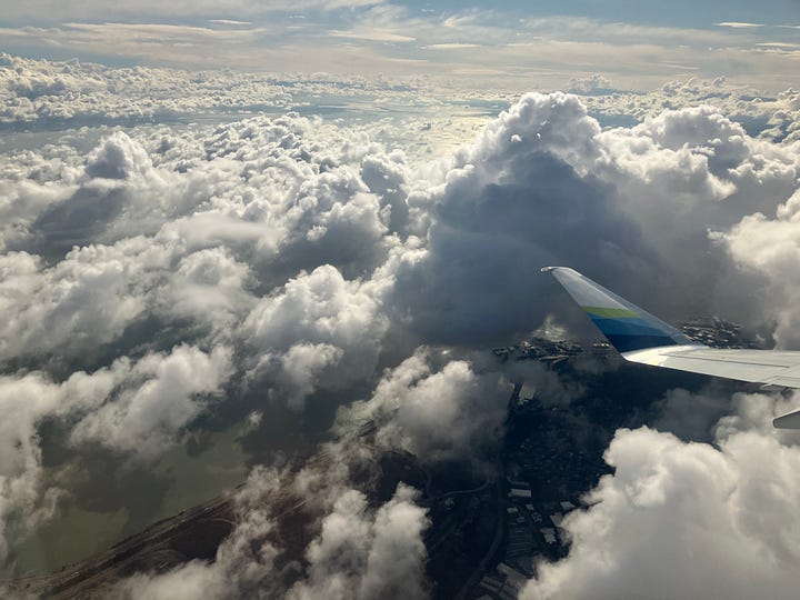 an image of South San Francisco from an airplane flying above and images of clouds from a plane in flight