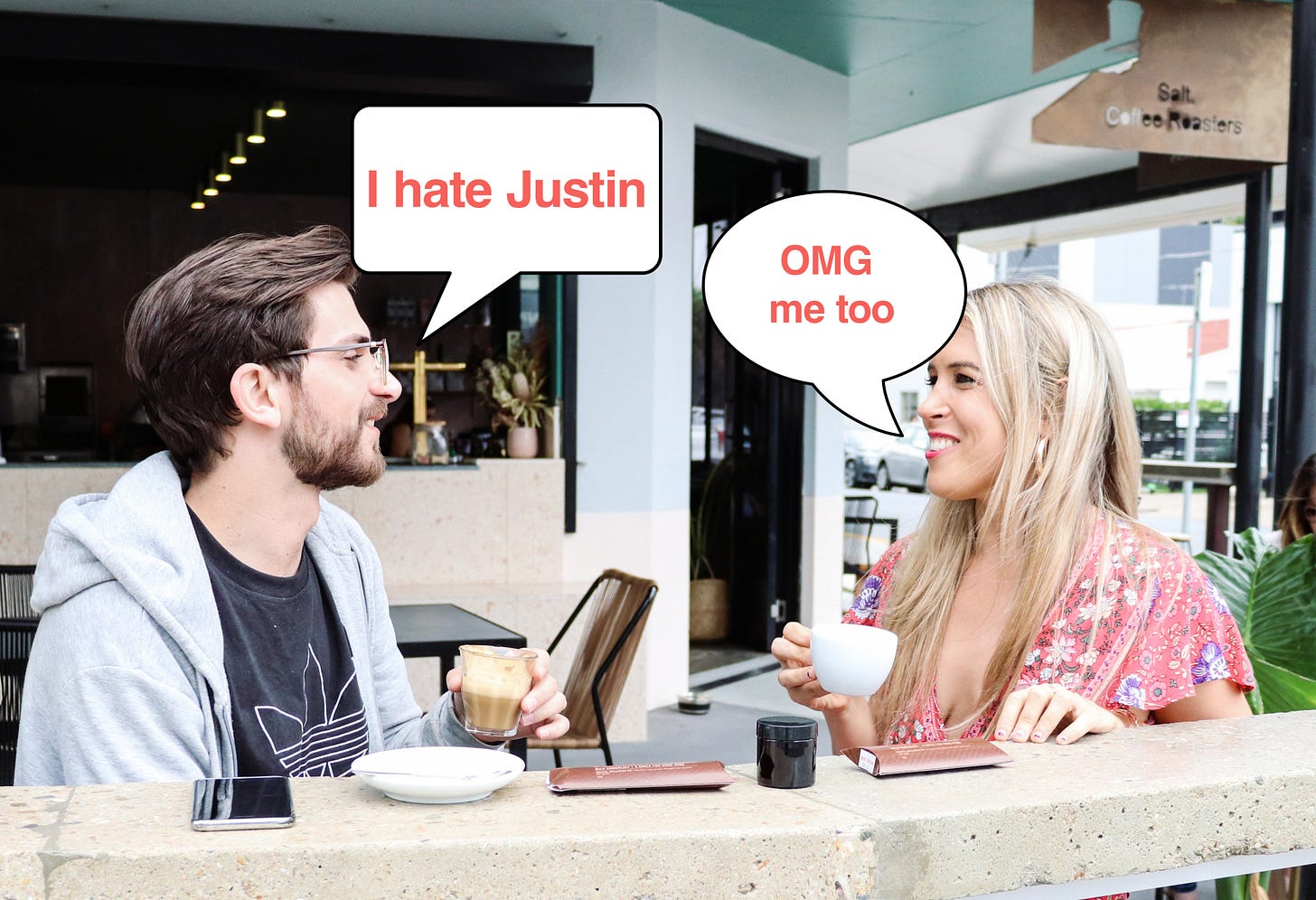 Two friends having brunch, one says: 'I hate Justin' and the other says 'OMG me too' Two friends having brunch, one says: 'I hate Justin' and the other says 'OMG me too'