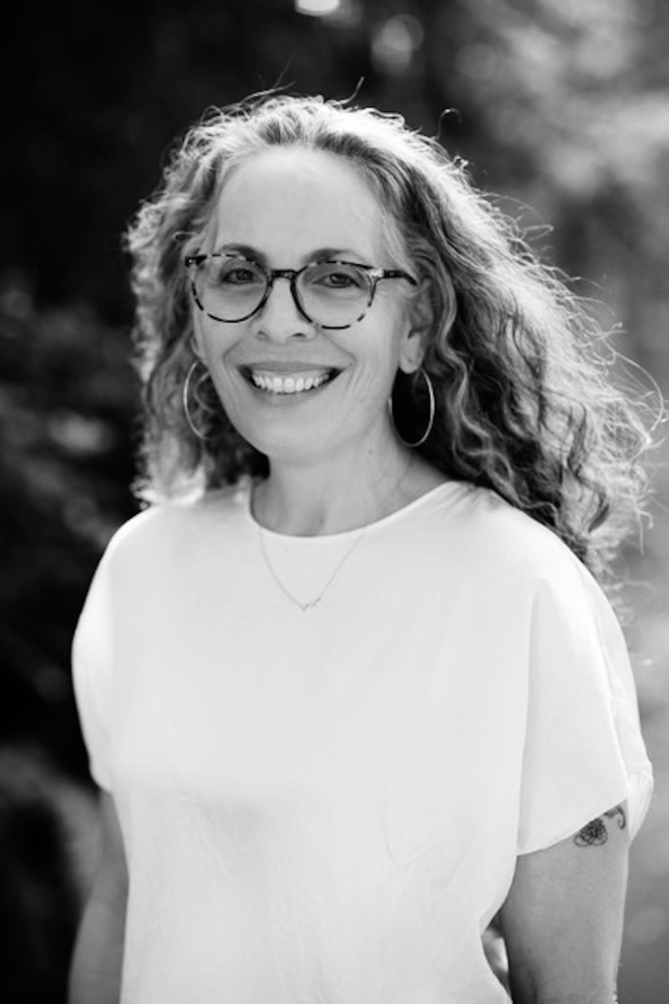 author photo of Catherine Prescott: a white woman with curly hair and glasses wearing a white t shirt author photo of Catherine Prescott: a white woman with curly hair and glasses wearing a white t shirt
