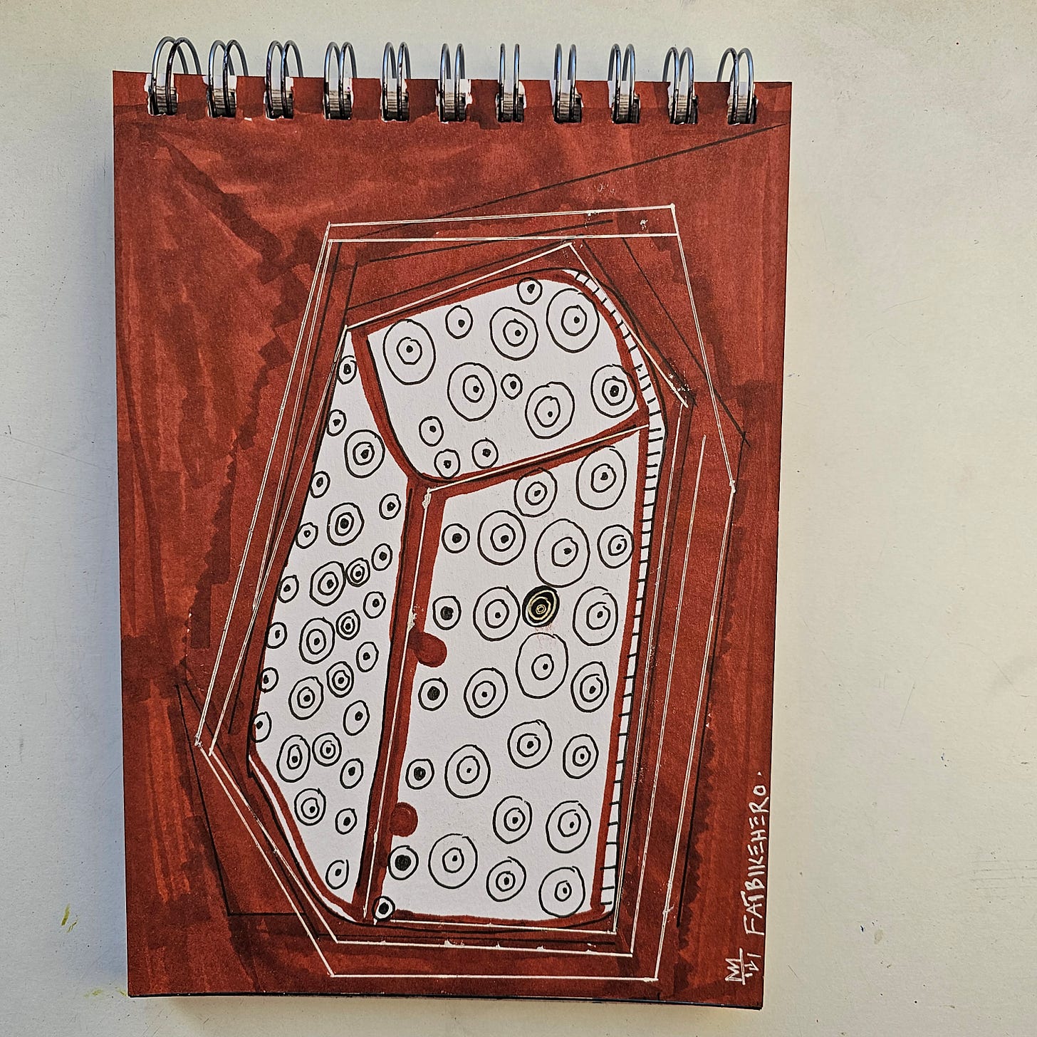 Alt Text: A marker and ink drawing by FatbikeHero titled "5G Roman Bone Box." It features a geometric, coffin-like box shape rendered in brown and white, covered in black concentric circles that look like eyes or sensors. The style is abstract and illustrative.