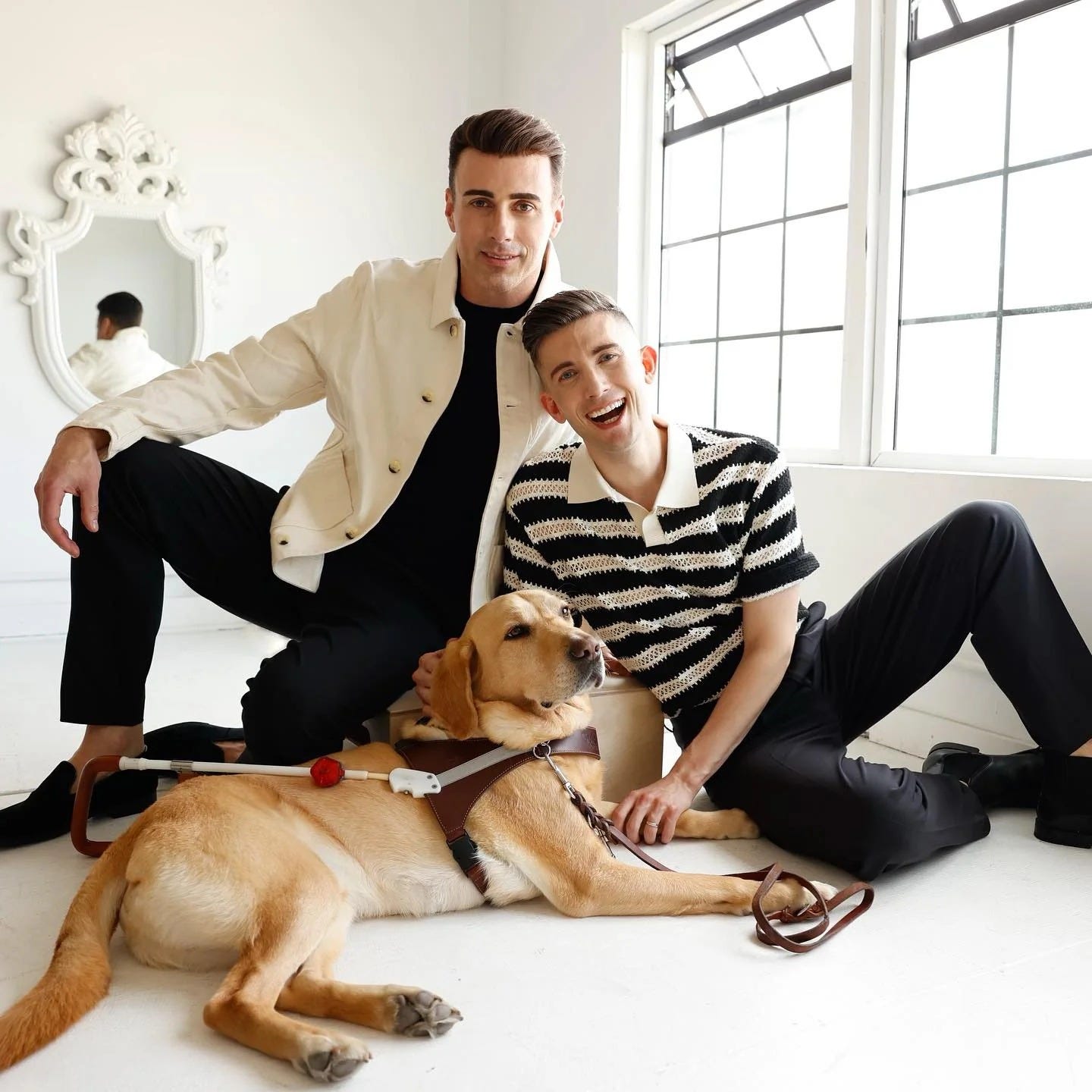 Portrait of Matthew Castle and Paul Castle with their guide dog, Mr. Maple.