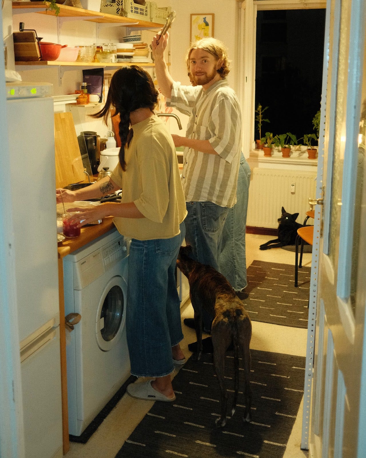 People stood in a kitchen. People stood in a kitchen.