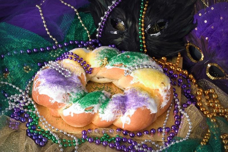 king cake with mardi gras beads